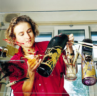 A glass painter adding her finishing touches