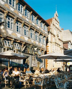 Facade of houses in the Weser Renaissance style with a cafe in the foreground
